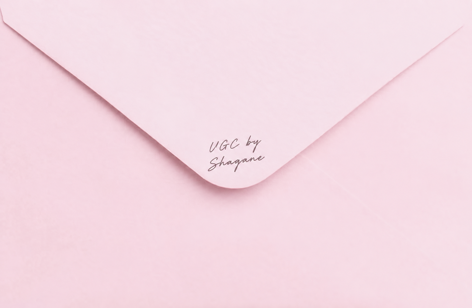 Pink envelope with handwritten UGC by Shagane